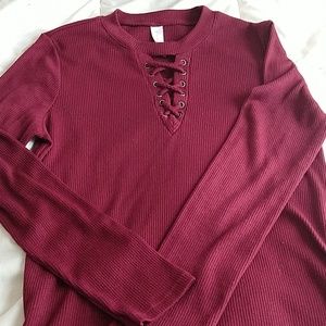 A long sleeve maroon shirt